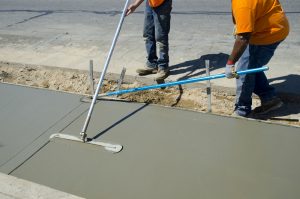 Workers laying concrete for a foundation in Cherry Hill