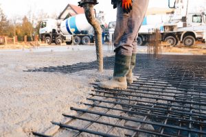 Concrete worker laying a foundation for a business in Cherry Hill